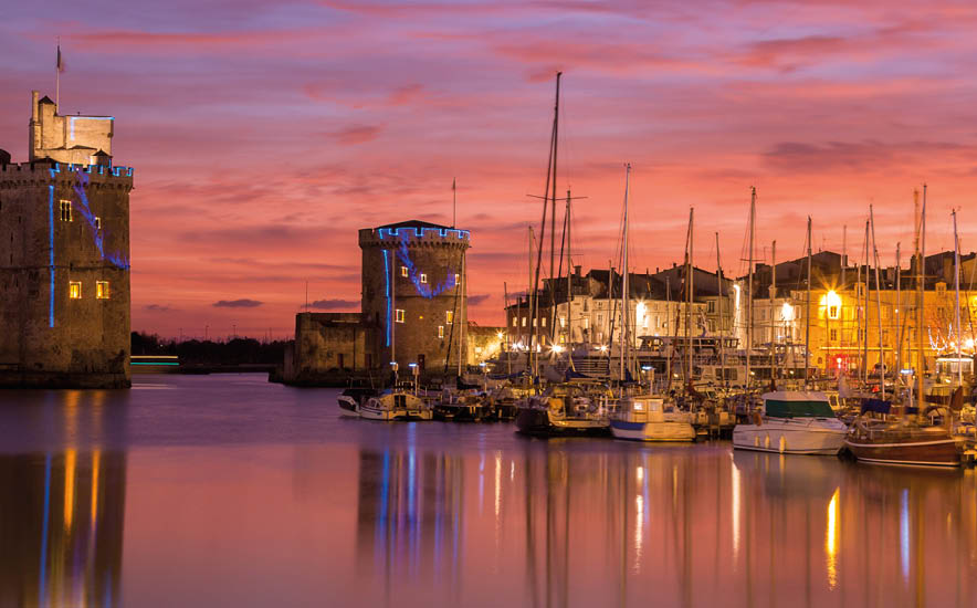 Panoramic view of Harbor by night with beautiful sunset in La Rochelle Town